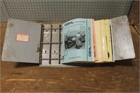 ASSORTMENT OF MANUALS AND MANUAL HOLDERS