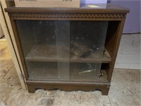 2 Drawer glass front cabinet w/contents