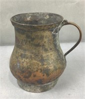 Antique metal pitcher