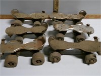 3 pair of old roller skates