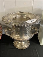 Hand repousse champagne urn.