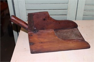 Wooden scoop with metal reinforced bottom