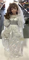 Porcelain doll on stand from “Knightsbridge