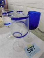 3 swirl and 1 solid cobalt wine glasses from Pier