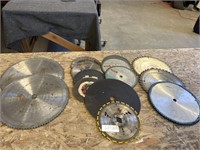 Assorted circular saw blades located on table