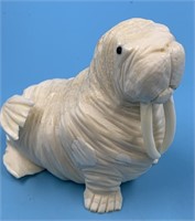 Walrus ivory carving of a walrus by Dennis Pungowi