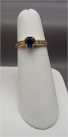 14K Yellow gold ring with sapphire colored center