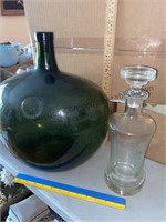 Large green glass bottle and decanter