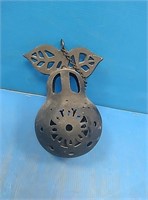 Pear shaped cast iron candle holder