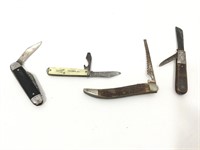 Four vintage pocket knives.