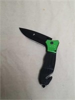 New green and black handled pocket knife