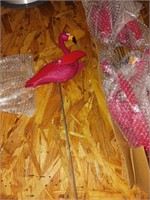 Two sets of six pink flamingo yard ornaments