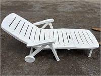 White plastic folding patio lounge chair