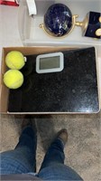 Scale with tennis balls