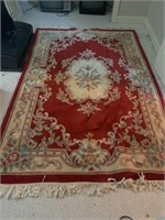 Rug approx 5 x 8 ft, red with floral pattern