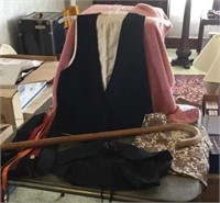 Assorted clothing and cane