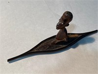 SMALL AFRICAN CARVING- MAN IN SMALL BOAT