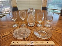 Four Wine Glasses, Two Glass Plates, and Carafe