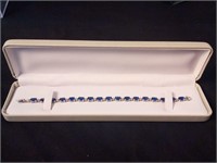 7" 10k Marked Tennis Bracelet with Blue Stones