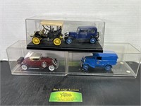 4 Die Cast Scale Model Cars With Display Cases