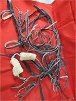 Assorted leather horse tack lot.