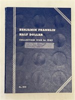 23 - silver Franklin half dollars in book