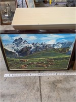 framed mountain painting