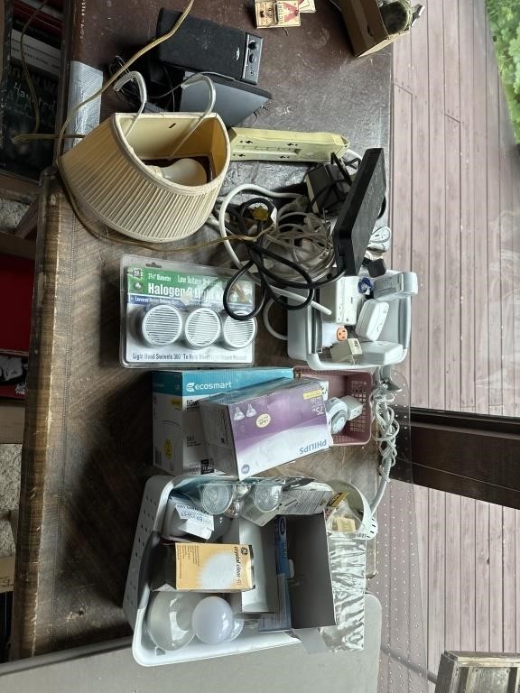 Assorted lightbulbs, surge protector, and more