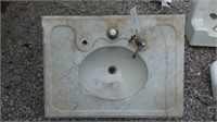 Marble sink with back splash and supports,