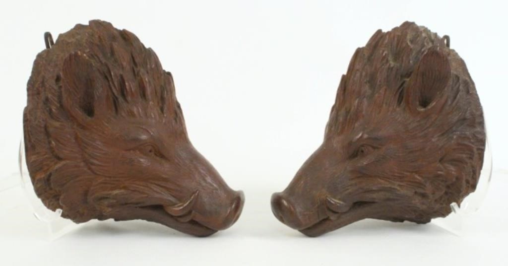 A Pair of Black Forrest Carved Boar's Heads
