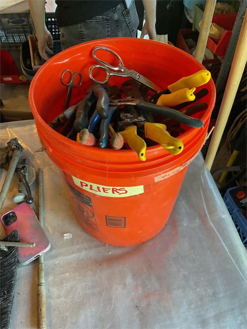 Bucket lot full of pliers and wire cutters