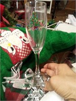 Lot of Christmas decor includes wine glasses,