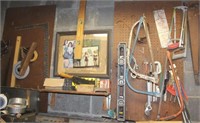 Pegboard/wall lot: steel plane, levels, bow saws;