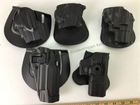 Five Paddle holsters, pictures, in plastic bag,