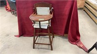 Vintage booster chair. Measures 17x37x17.5 inches