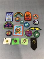 Assorted Girl Scout patches and pins