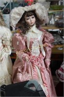 LARGE PORCELAIN DOLL AND STAND