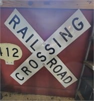 Large metal railroad crossing sign