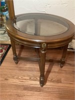 Round glass top side table.