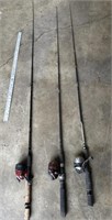 Three fishing rods and reels