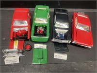 Four plastic models. Includes a 1976 Chevy Nova