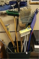 GARBAGE CAN AND BROOMS AND ONE RAKE