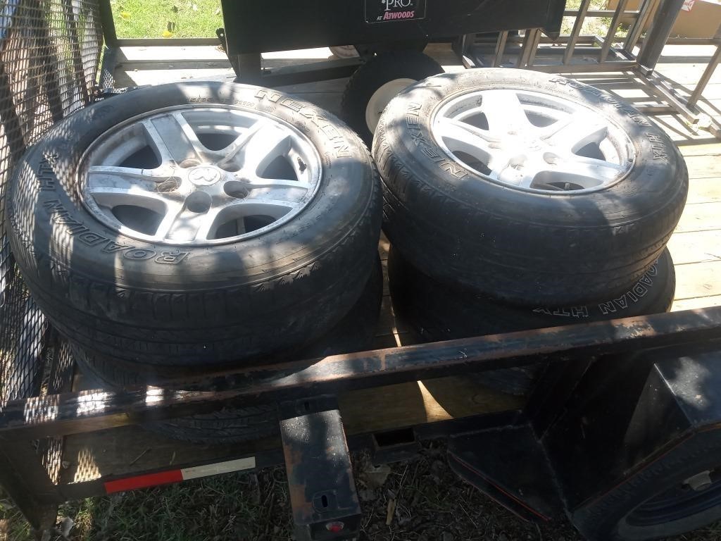 Set of four tires and rims.  Tire size 245 65 17.