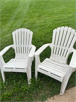 Two white patio chairs