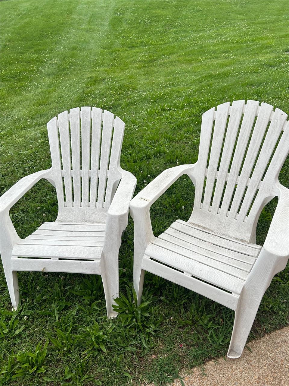 Two white patio chairs