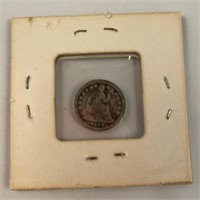 1857 seated liberty half dime in holder,