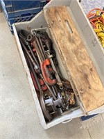 Vintage wooden box full of rigid pipe threading