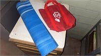 Blue Yoga Mat / Box of Girl Scout badges and Girl