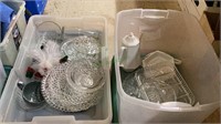 Two lidded plastic tubs of glassware. Contains