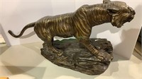 Vintage bronze tiger sculpture, on a hollow